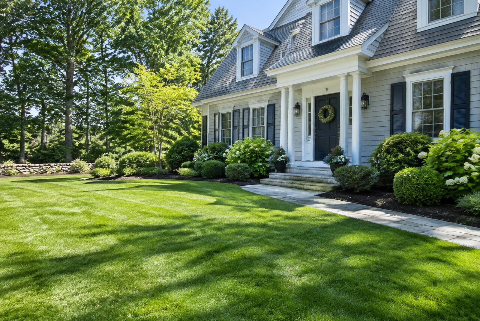 Front lawn of a New England home after a property cleanup